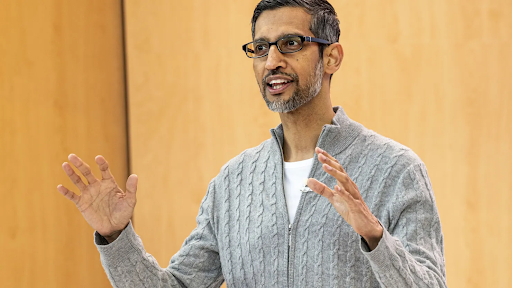 Google employees questioning costumed executives at an all-hands meeting on cost cuts